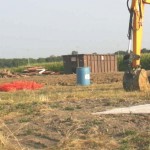 barn buried trash